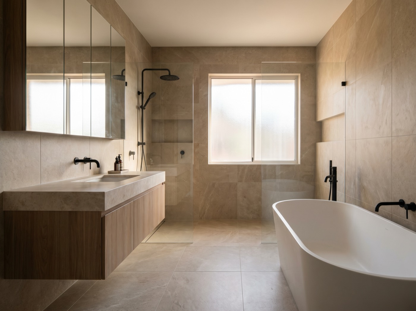 Renovated modern bathroom with stone tiling and floating vanity